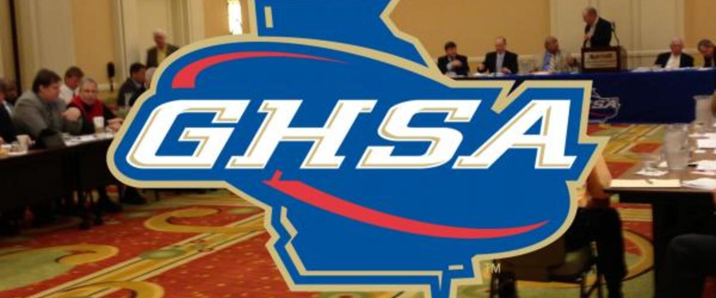 GHSA logo over board meeting