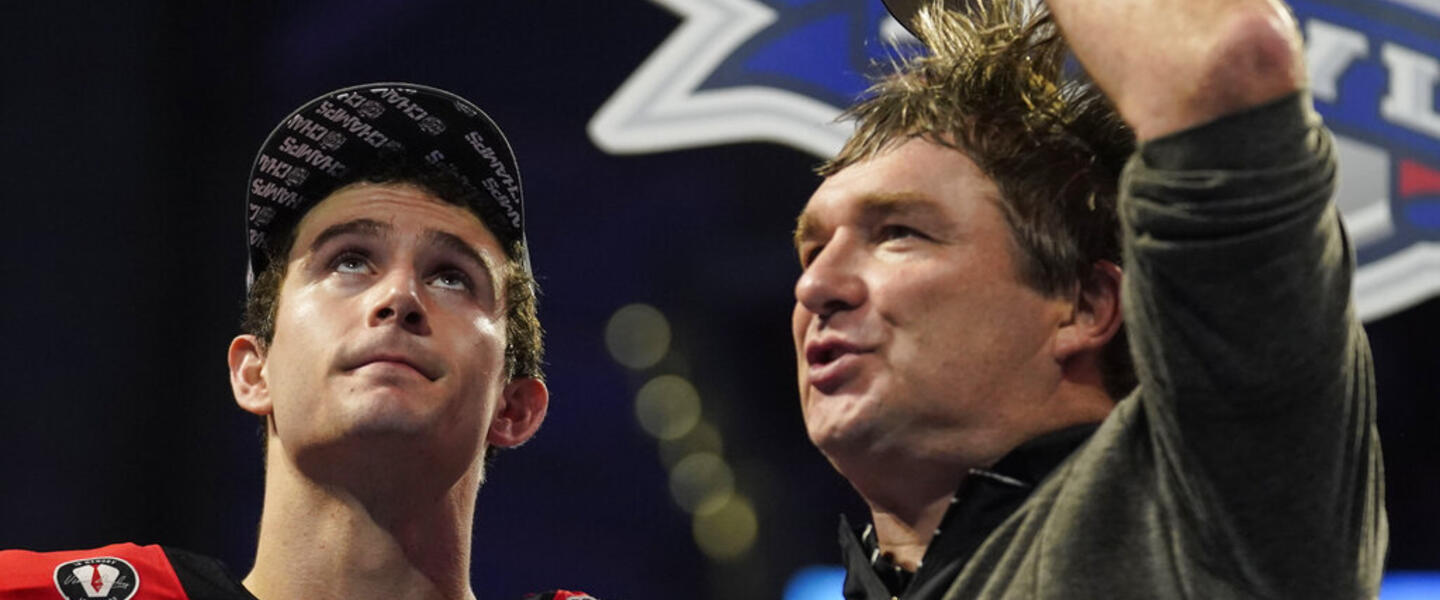 Georgia quarterback Stetson Bennett celebrates with Georgia head coach Kirby Smart after the Peach Bowl NCAA college football semifinal playoff game between Georgia and Ohio State, Sunday, Jan. 1, 2023, in Atlanta. Georgia won 42-41.(AP Photo/Brynn Anderson)