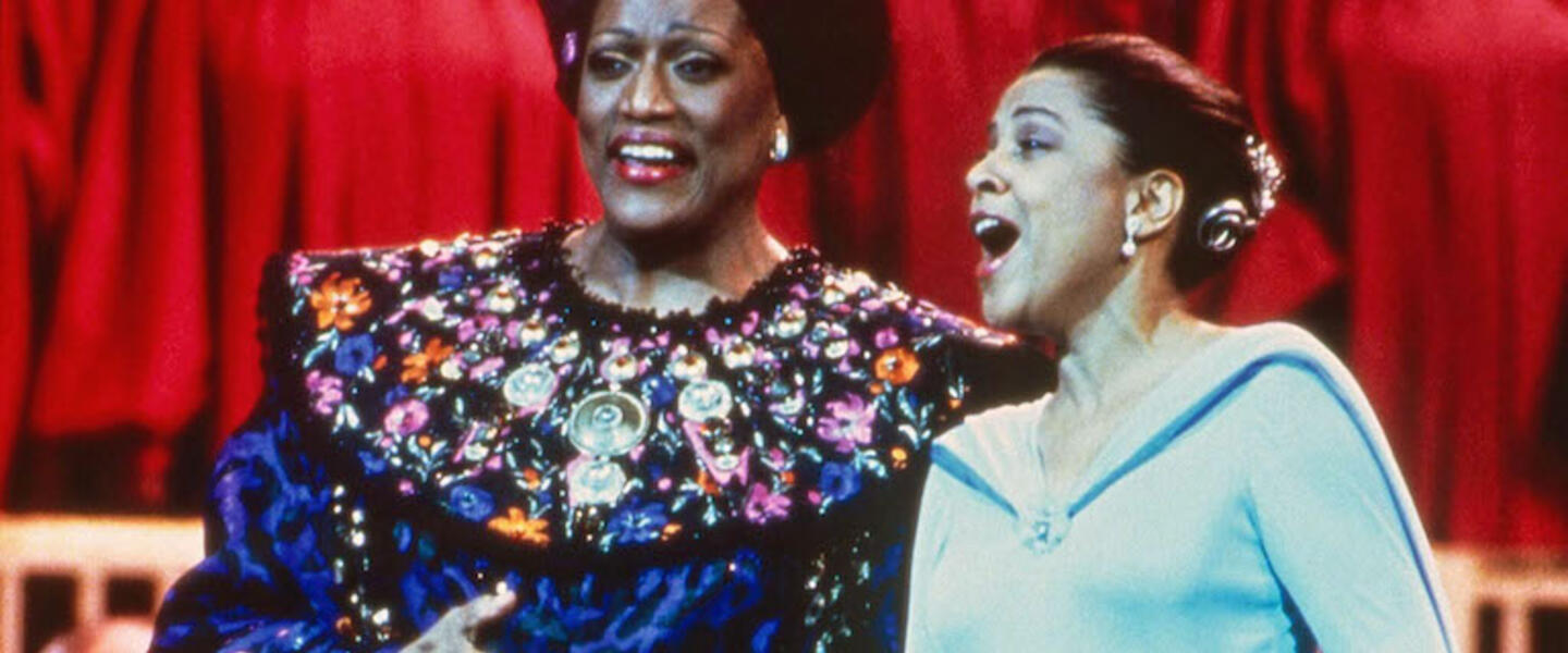Jessye Norman and Kathleen Battle singing on stage.