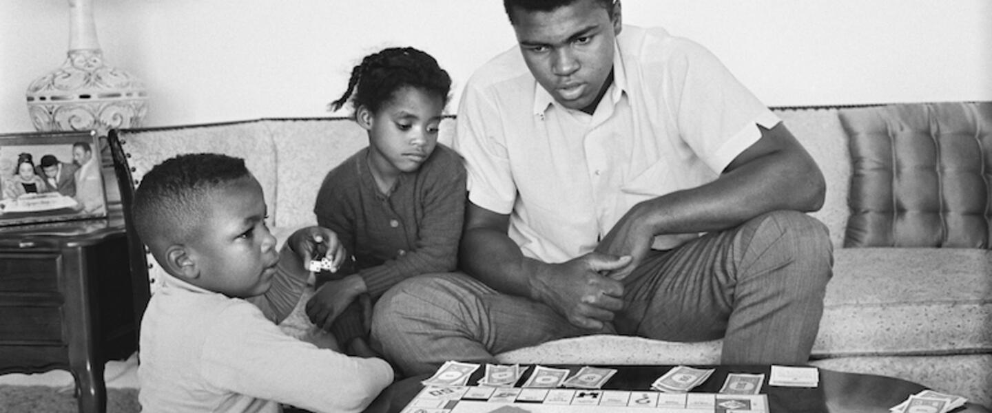 Muhammad Ali and his children play Monopoly.
