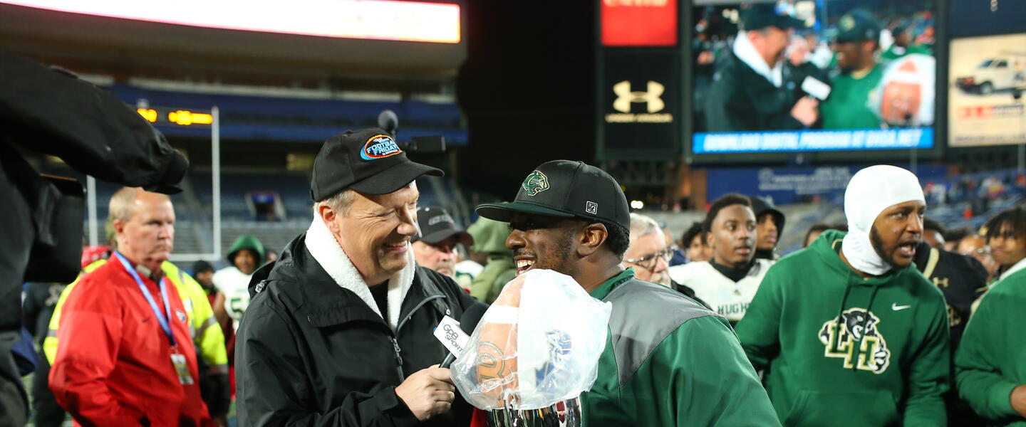 Langston Hughes Head Coach Daniel "Boone" Williams talks with GPB's Jon Nelson after his 6A State Championship win..