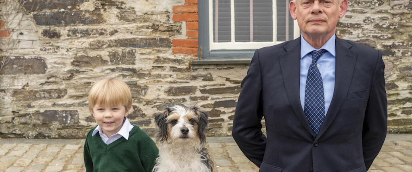 Martin Clunes as Doc Martin and the actor that plays his son.