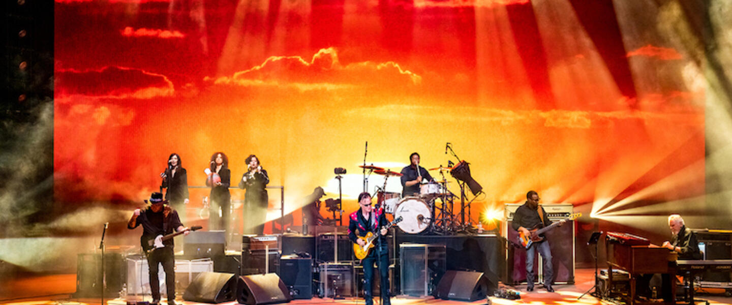 Joe Bonamassa and his band on stage.