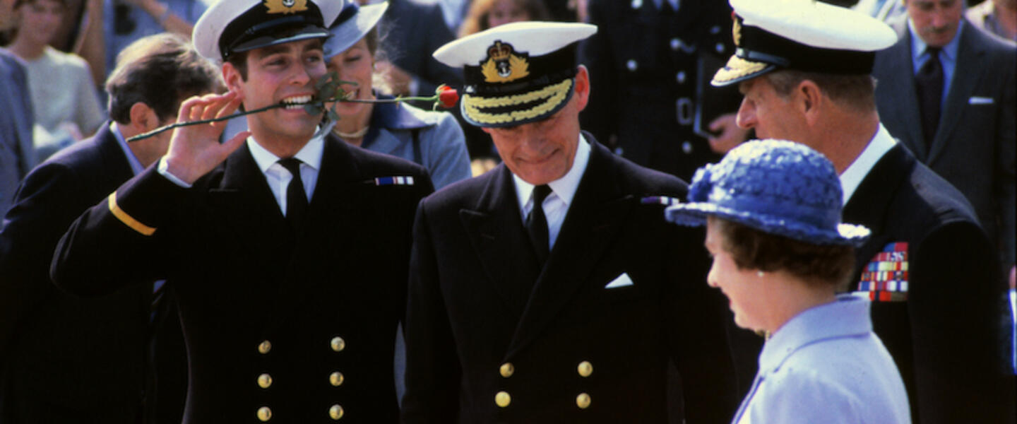 Princes Andrew and Philip in naval attire with Queen Elizabeth.