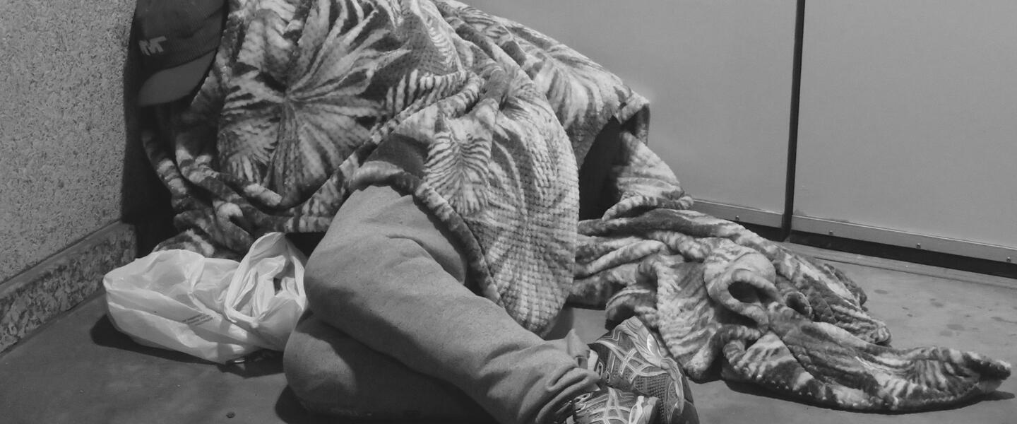 Unhoused man asleep