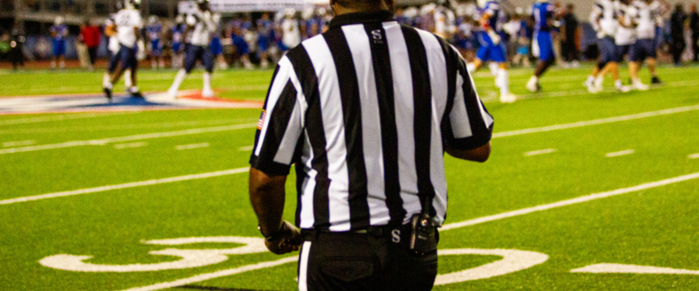 Referee at football game.