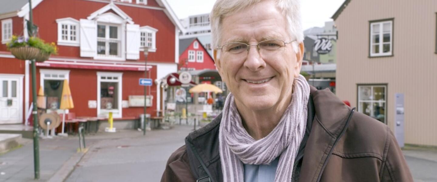 Rick Steves standing on a street in Iceland