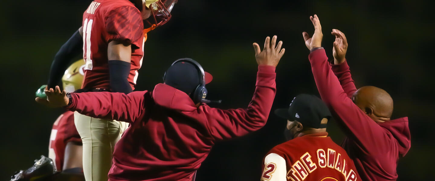 Creekside Seminoles celebrate a big play during their game.