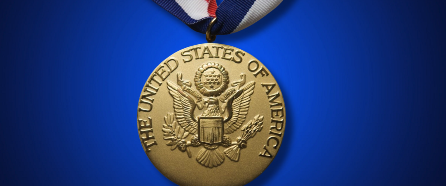 U.S. presidential scholar medal on blue background