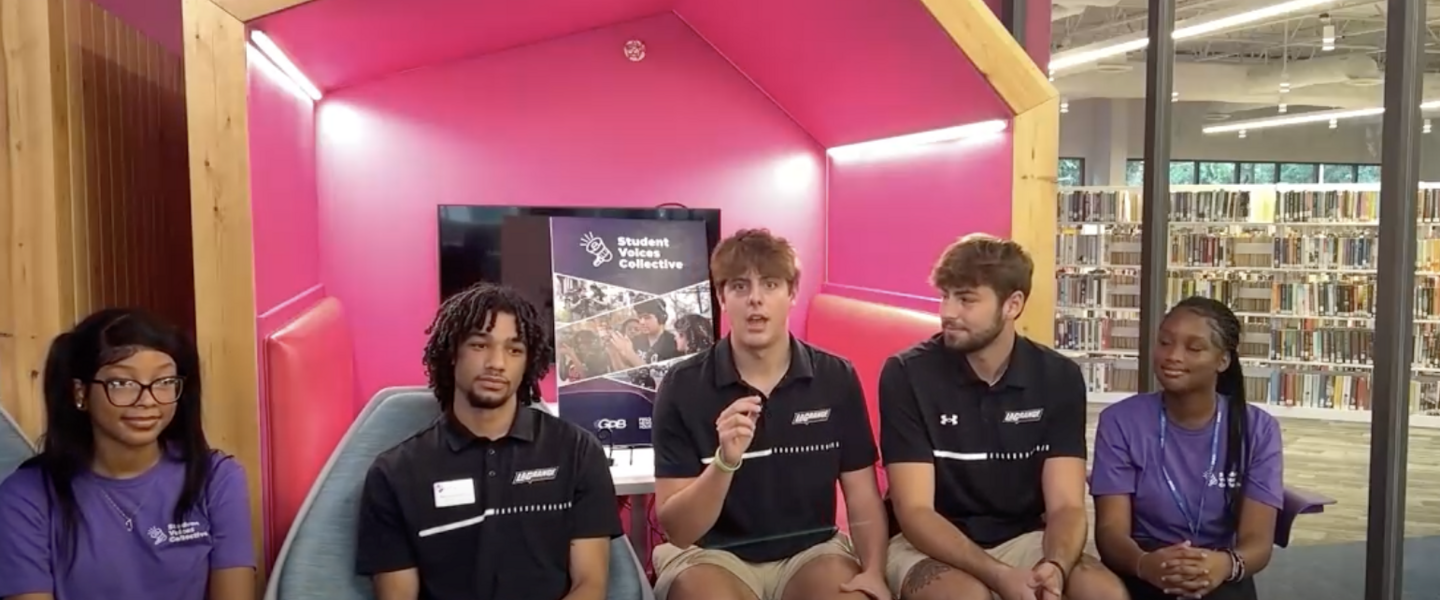 LaGrange High School students TyCianna Rome (left) and Chariya Johnson (right) interview LaGrange College men's basketball players (left to right) Tayshawn Pendleton, Ethan Richerzhagen and Colin Slatton in September 2024.