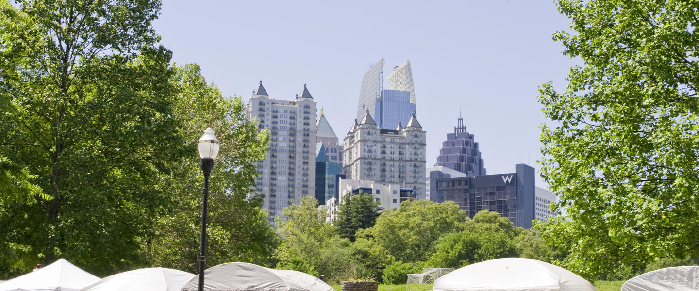 Attendees visit tents at the Atlanta Dogwood Festival at Piedmont Park.