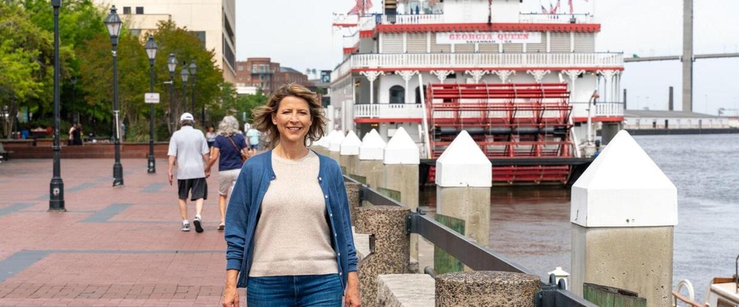 Host Samantha Brown walks by the Savannah riverfront in Savannah, Georgia
