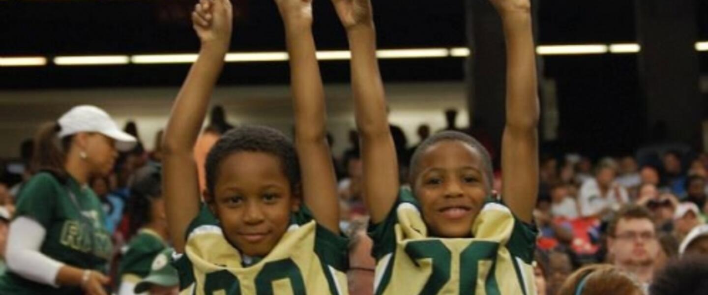 Young Grayson fans cheer on their Rams with a front row view. Young Grayson fans cheer on their Rams with a front row view.