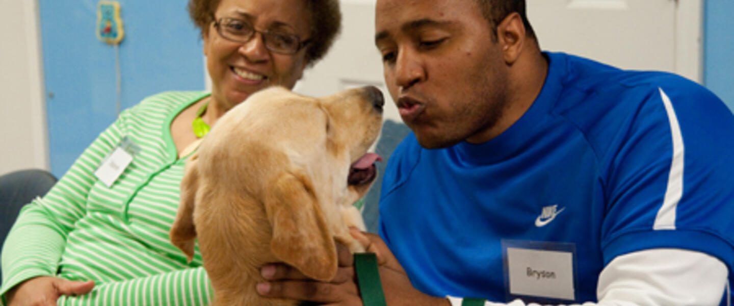Bryson Casey with his dog Wagner during a training session at Canine Assistants. Photo courtesy of David Scott. Bryson Casey with his dog Wagner during a training session at Canine Assistants. Photo courtesy of David Scott.