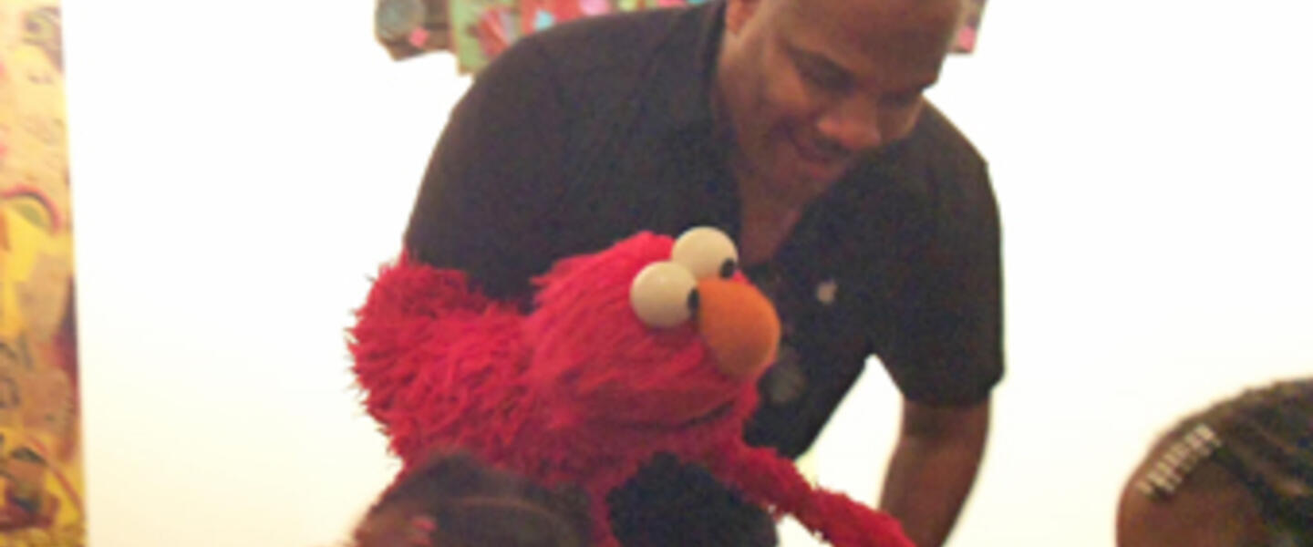 Elmo hobnobs with kids from Sheltering Arms at the science and arts education announcement. Elmo hobnobs with kids from Sheltering Arms at the science and arts education announcement.