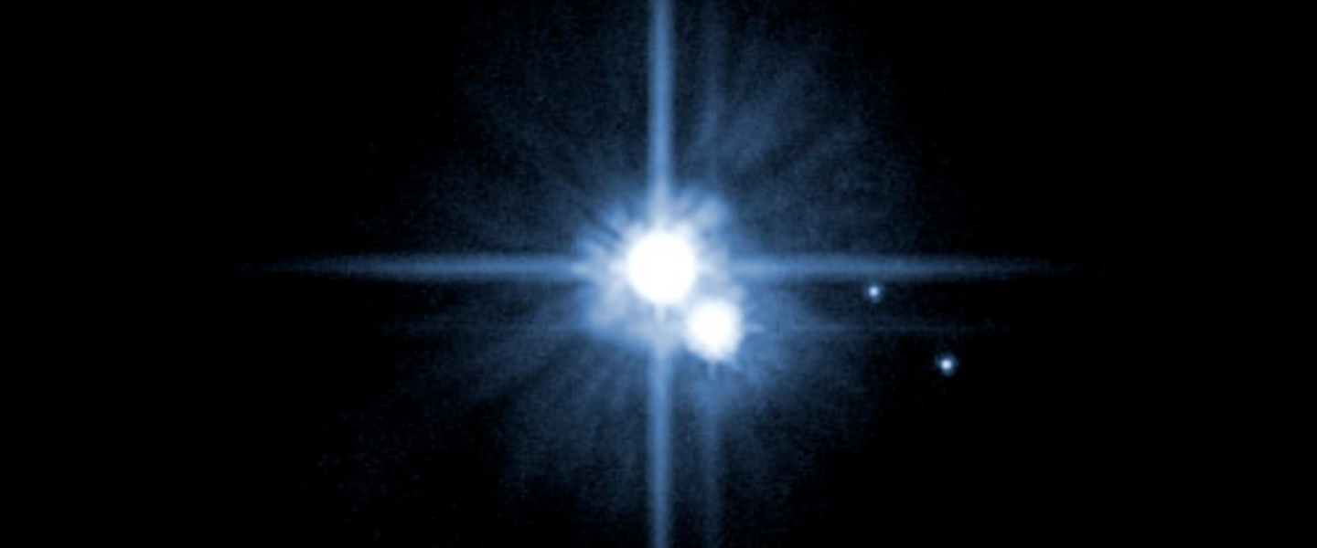 2005, then-new moons Nix and Hydra are the dots on the right. Credit: NASA, ESA, H. Weaver (JHU/APL), A. Stern (SwRI), HST Pluto 2005, then-new moons Nix and Hydra are the dots on the right. Credit: NASA, ESA, H. Weaver (JHU/APL), A. Stern (SwRI), HST Pluto