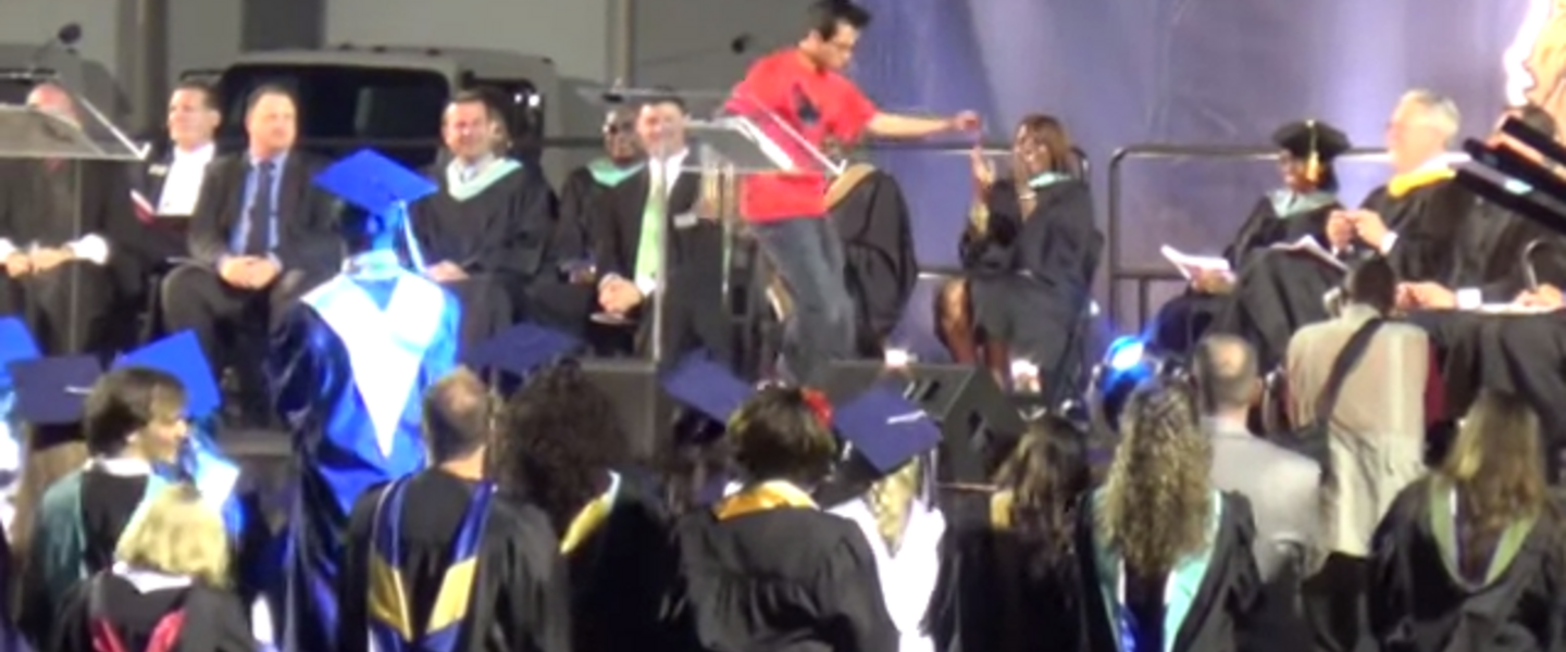Parker Pitisci dances across his graduation stage.