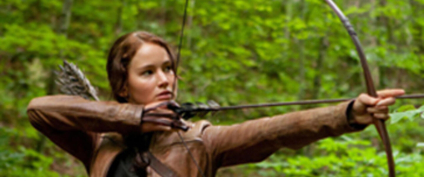 Jennifer Lawrence stars as 'Katniss Everdeen' in "The Hunger Games." Photo credit: Murray Jennifer Lawrence stars as 'Katniss Everdeen' in "The Hunger Games." Photo credit: Murray