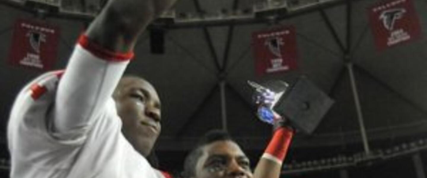 Photo special to GPB. Alex Chisum (L) and Ronnie Bell (R) celebrate after Sandy Creek's state final win over Carrollton. Photo special to GPB. Alex Chisum (L) and Ronnie Bell (R) celebrate after Sandy Creek's state final win over Carrollton.