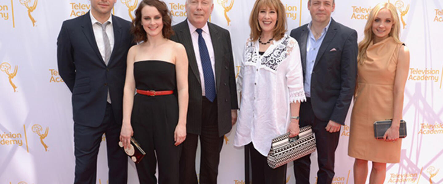 Downton Abbey Cast members and producers Julian Fellowes and Gareth Naeme mug for cameras before their webast. Downton Abbey Cast members and producers Julian Fellowes and Gareth Naeme mug for cameras before their webast.
