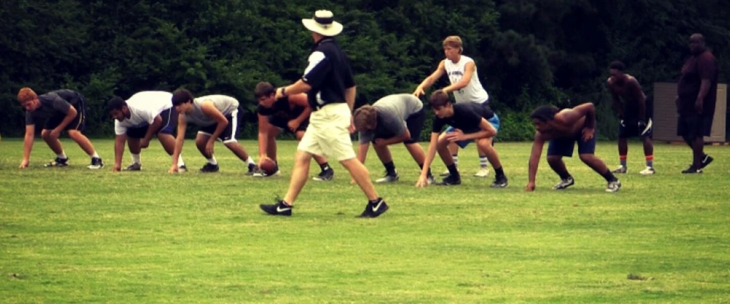 New Carrollton Head Coach Ed Dudley directs the action at a summer practice. New Carrollton Head Coach Ed Dudley directs the action at a summer practice.