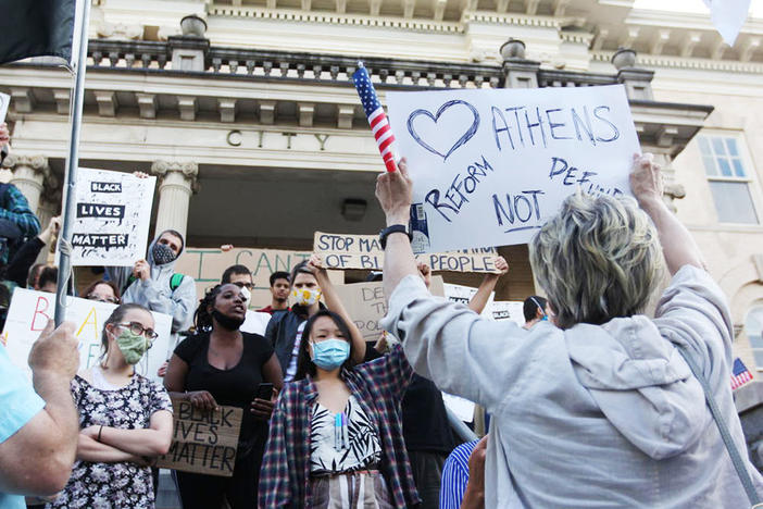 Protesters at Athens-Clarke County City Hall clash during a public input meeting for the 2021 local government budget on June 16, 2020 in Athens, Georgia. A budget amendment proposing a reallocation of funds within the Athens-Clarke County Police Department brought hundreds of citizens out both in opposition and support of the proposal. 