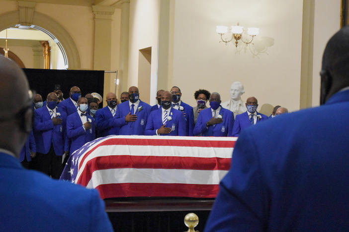 Members of the Phi Beta Sigma fraternity honor Rep. John Lewis in an Omega Ceremony at the Georgia State Capitol.