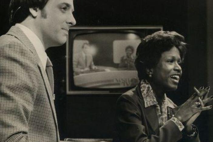 John Pruitt (left) and Monica Pearson (right) anchor an evening broadcast on WSB-TV.