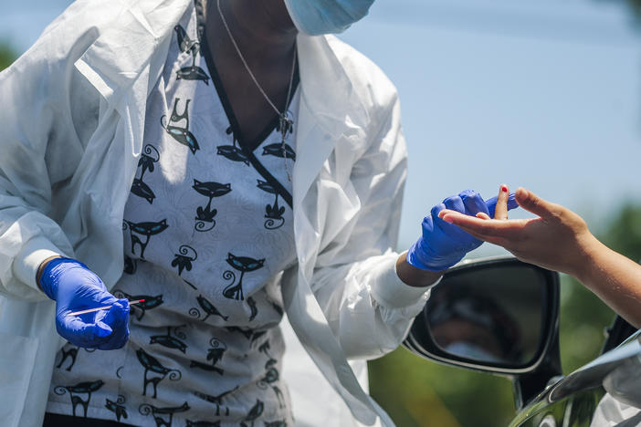 Healthcare provider administers Coronavirus test at pop-up site in Macon