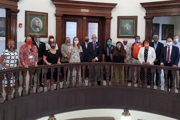 Members of Savannah's new race equity task force assemble in the city hall rotunda.