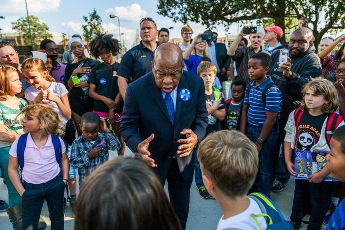 John  Lewis speaks to a group of children.