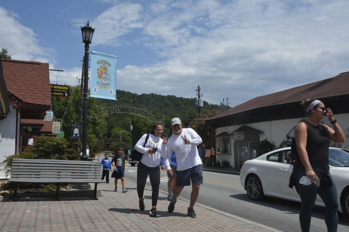 Two unidentified and unmasked pedestrians pose for GPB's camera in Helen, GA on Wednesday, August 19.