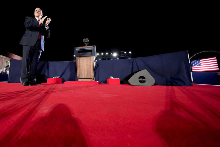 Pence stands on the stage at the RNC.