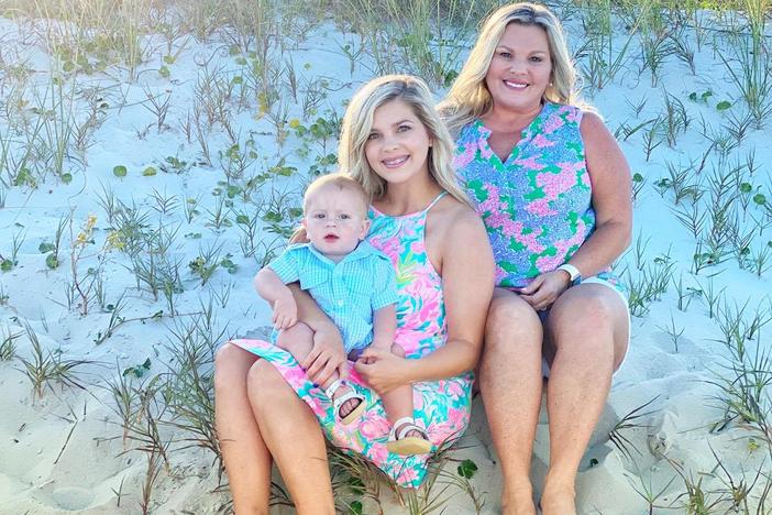 Langston Kinlaw, held by mother Breanna Kinlaw, and Brandy Gillis (right)