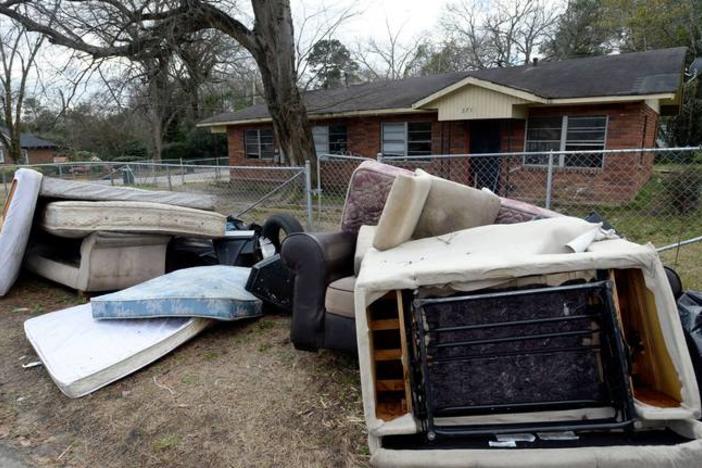 Furniture and other belongings sit at the curb after the Magistrate Court Sheriff’s office supervised a court ordered eviction on Del Park in late January 2019. 