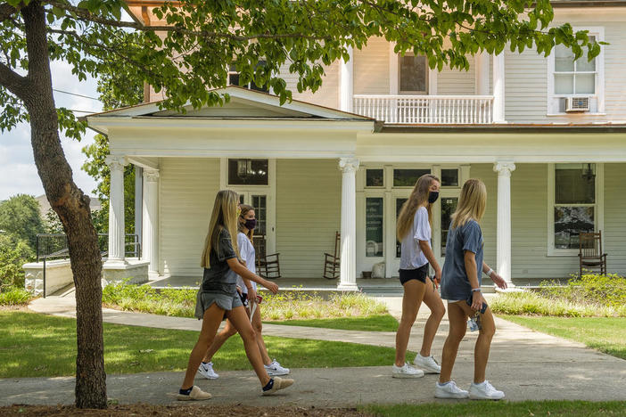 Students on campus at Georgia College and State University in MIlledgeville.