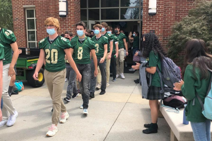 Pinecrest Academy Football Team Wears Masks