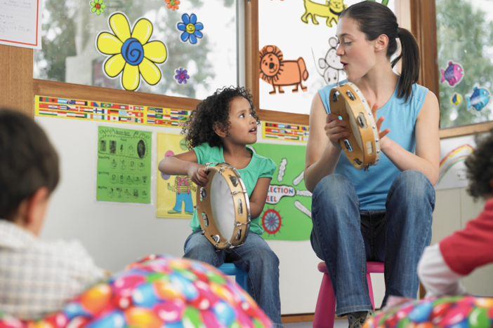 Music teacher with student
