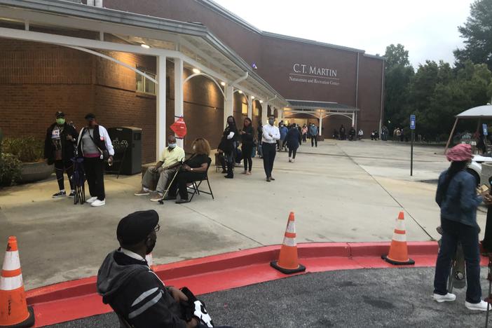 More than 200 voters wait in line at the C.T. Martin Natatorium in Fulton County before polls open for early voting.