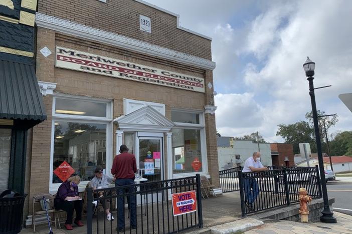A voter signs in to cast a ballot at Meriwether County's lone early voting location in downtown Greenville.