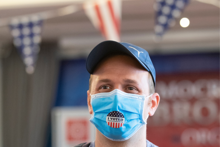 Elliott Zaagman from Michigan wears his mask after casting his vote.