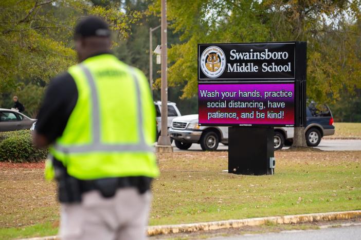 Officer directs traffic outside Swainsboro Middle School