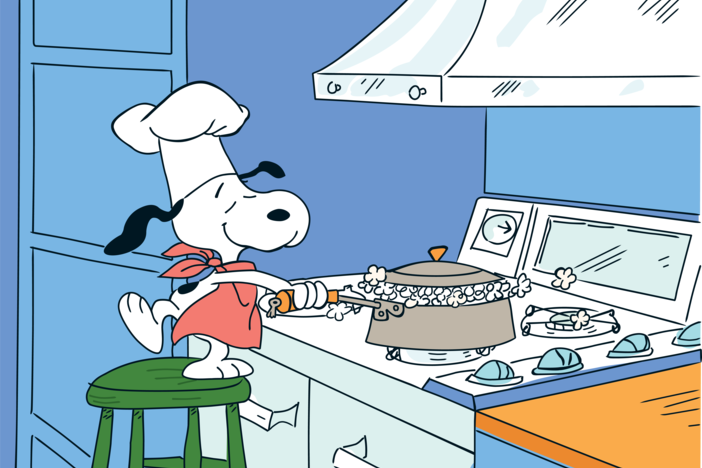 Snoopy popping popcorn.