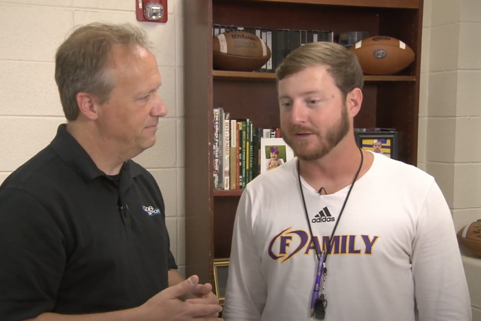 GPB's Jon Nelson (left) talks with Tucker Pruitt (right), the head football coach at Fitzgerald High School.