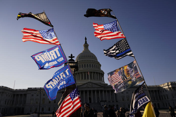 With the U.S. Capitol in the background, flags fly as supporters of President Donald Trump attend pro-Trump marches, Saturday Nov. 14, 2020, in Washington. 