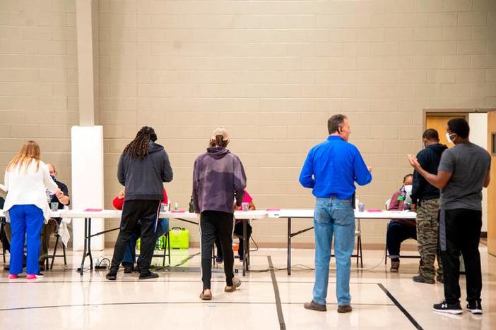 Voters line up at a polling location.