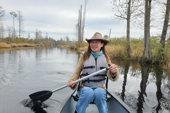 Rena Peck paddles a canoe in the Okefenokee swamp