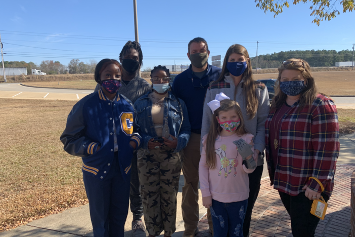 Students and teacher with prosthetic 