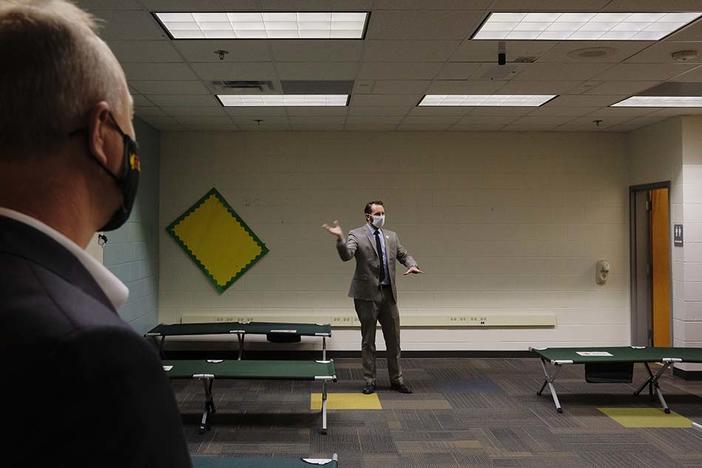 Macon-Bibb County Emergency Management Director Spencer Hawkins gives a tour of the new Brookdale Warming Center Monday. 