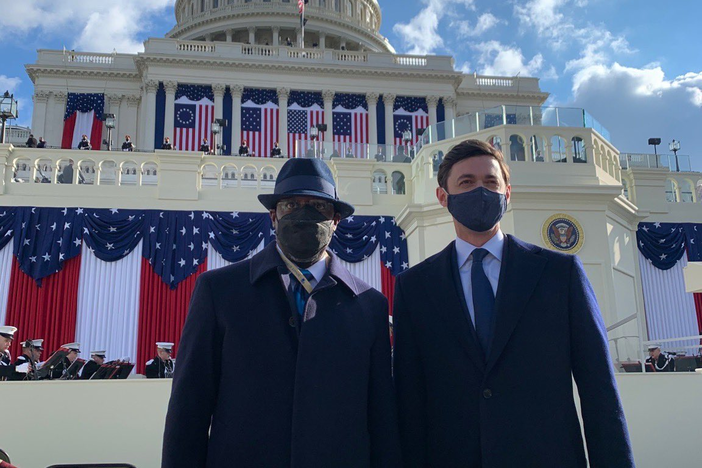 Sens. Raphael Warnock and Jon Ossoff pose in front of the U.S. Capitol before the inauguration of President Joe Biden.